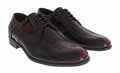 Chaussures formelles en cuir noir et bordeaux de Dolce & Gabbana, élégantes et sophistiquées, vues en gros plan.