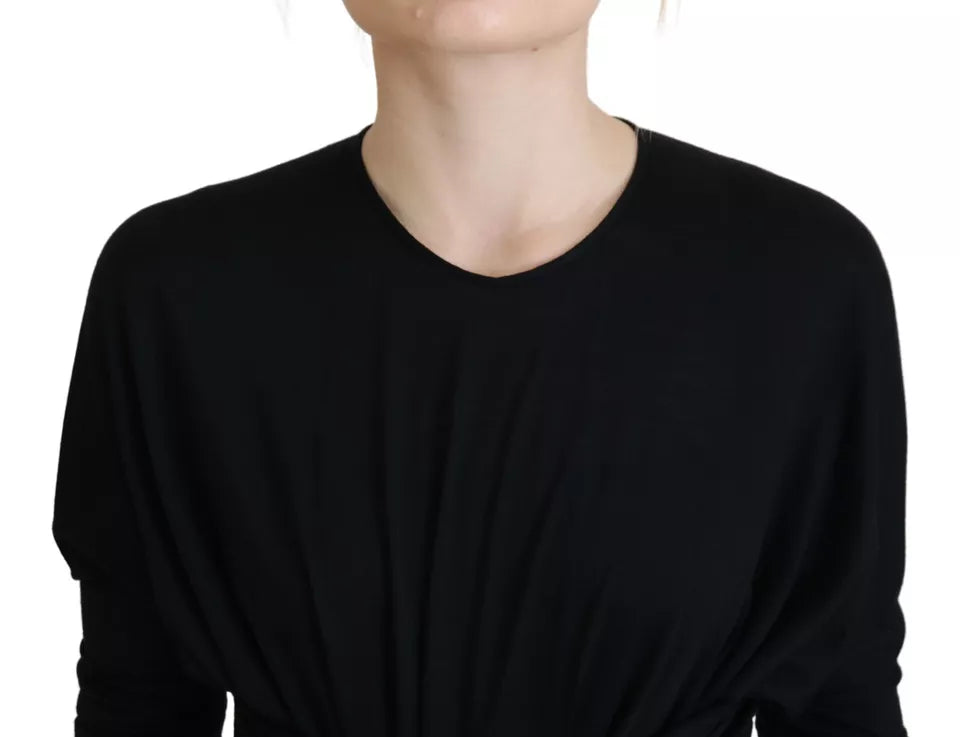 Robe midi en laine noire Dolce & Gabbana, robe trapèze élégante avec ceinture, vue en gros plan sur le tissu et la coupe.