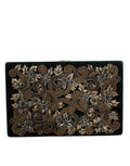 Sac pochette Dolce & Gabbana en velours noir avec cadre or pour soirée et fête, élégant et sophistiqué.