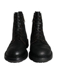 Bottes homme Dolce & Gabbana en cuir noir à lacets mi-mollet, style élégant et moderne.