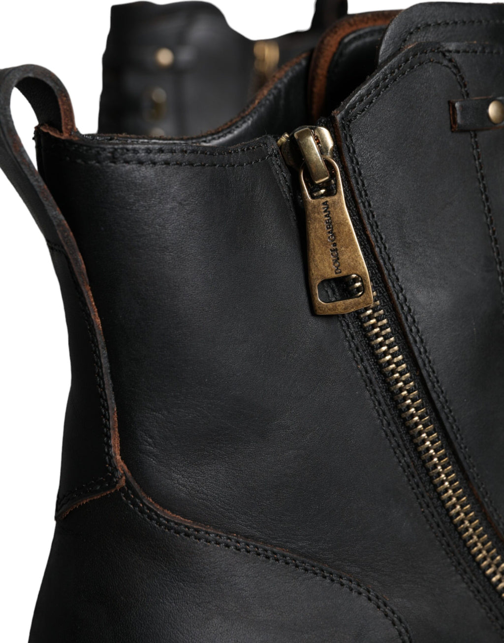 Bottes pour homme Dolce & Gabbana en cuir noir avec lacets, mi-mollet, style élégant et moderne.