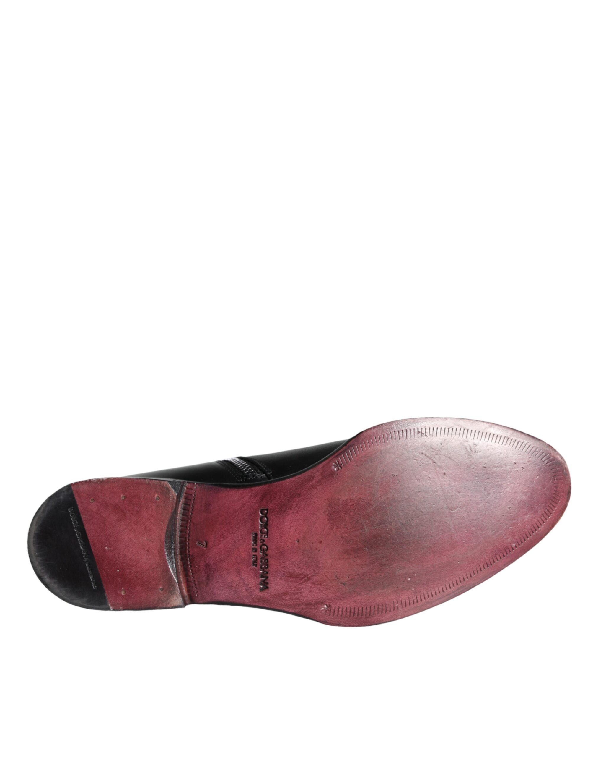 Chaussures pour homme Dolce & Gabbana en cuir de veau noir, bottines à la cheville élégantes et sophistiquées.