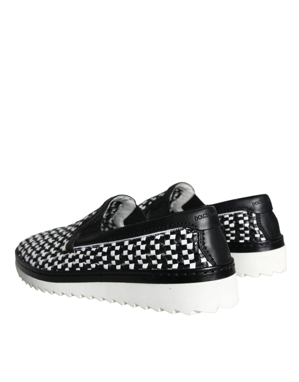 Chaussures loafers Dolce & Gabbana pour homme, noir et blanc tissés, style slip-on, élégantes et confortables.