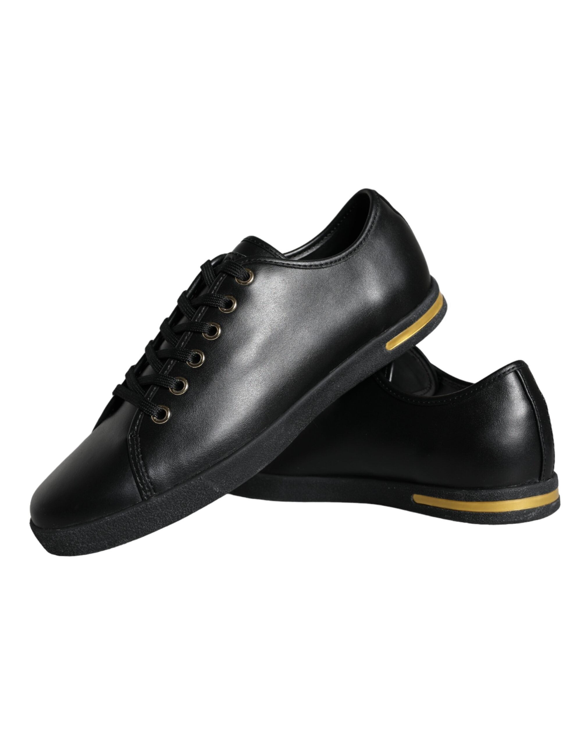 Chaussures sneakers Dolce & Gabbana noires en cuir avec détails dorés, style classique et élégant.