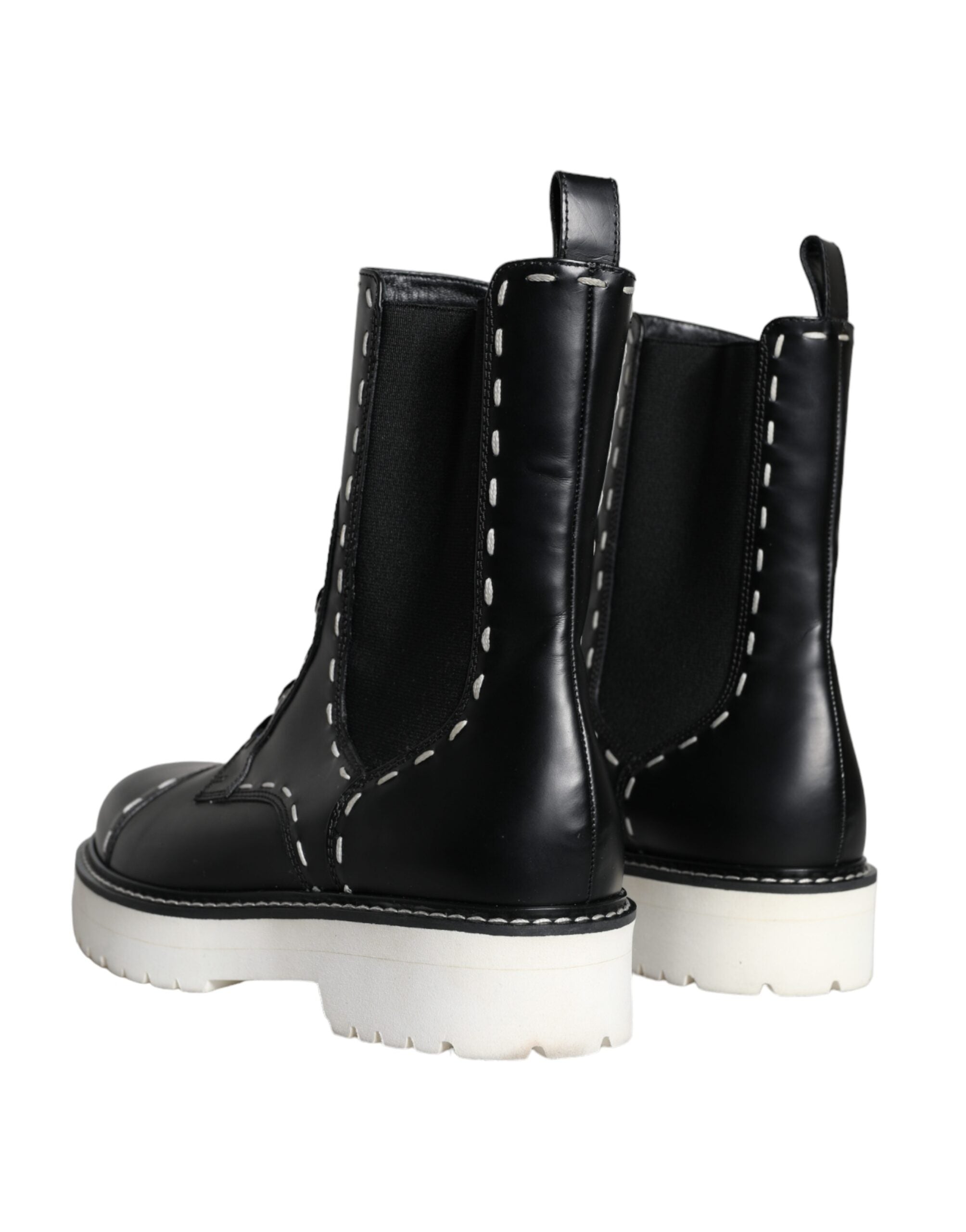 Bottes marron en cuir noir Dolce & Gabbana, combat mi-mollet, avec semelle robuste et détails élégants, chaussures tendance et sophistiquées.