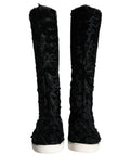 Bottes en cuir et fourrure de mouton noir Dolce & Gabbana Xiangao, élégantes et sophistiquées, vues de face.