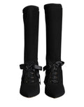 Chaussures Dolce & Gabbana, bottines noires à talons stiletto mi-mollet, élégantes et sophistiquées.