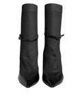 Chaussures Dolce & Gabbana en cuir noir, bottines stilettos avec chaussettes intégrées, vue de face sur fond blanc.