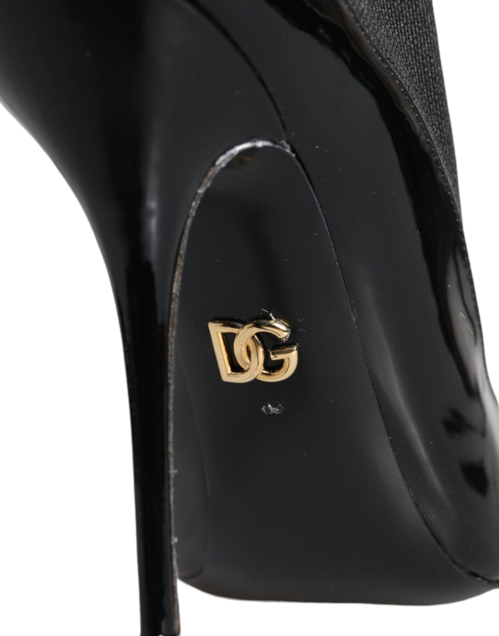 Bottines en cuir noir Dolce & Gabbana avec talons aiguilles et chaussettes intégrées, élégantes chaussures de luxe.