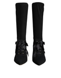 Chaussures Dolce & Gabbana, bottines noires à talons stilettos, mi-mollet, élégantes et sophistiquées.