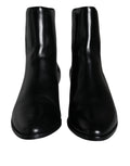 Bottines en cuir noir Dolce & Gabbana pour femme, chaussures à la cheville avec talon élégant et design sophistiqué.