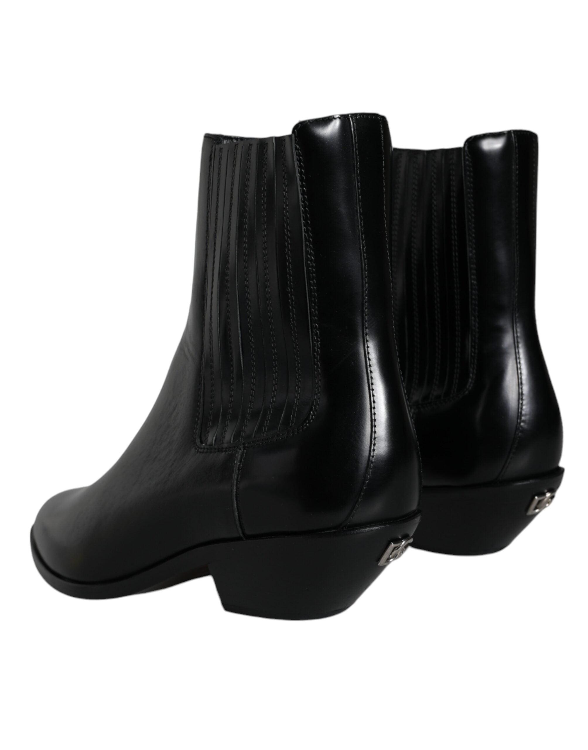 Bottines en cuir noir Dolce & Gabbana, chaussures à la cheville avec talon, style élégant et sophistiqué.