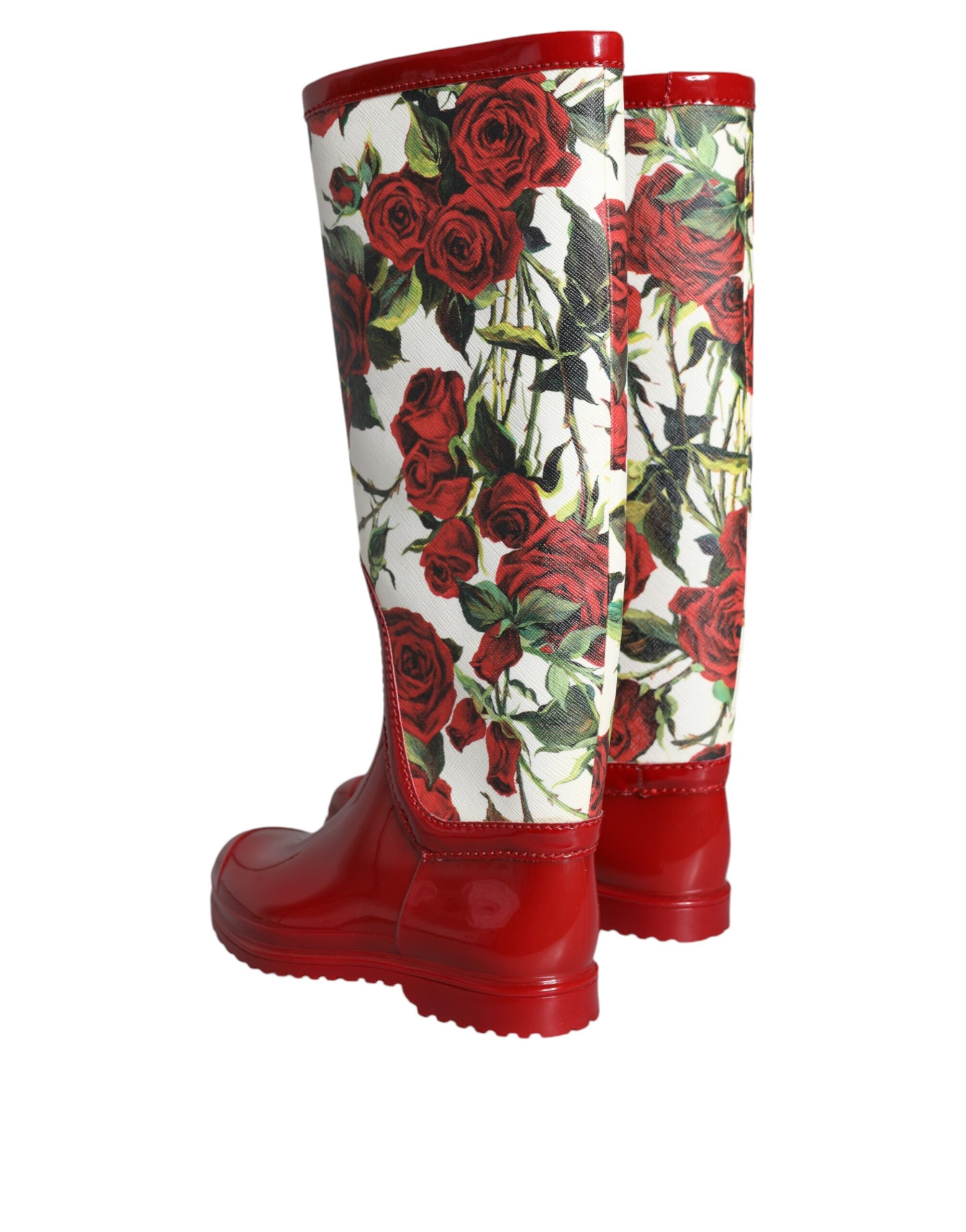 Bottes en caoutchouc rouges à fleurs Dolce & Gabbana, bottes hautes plates pour femme, style floral et élégant.