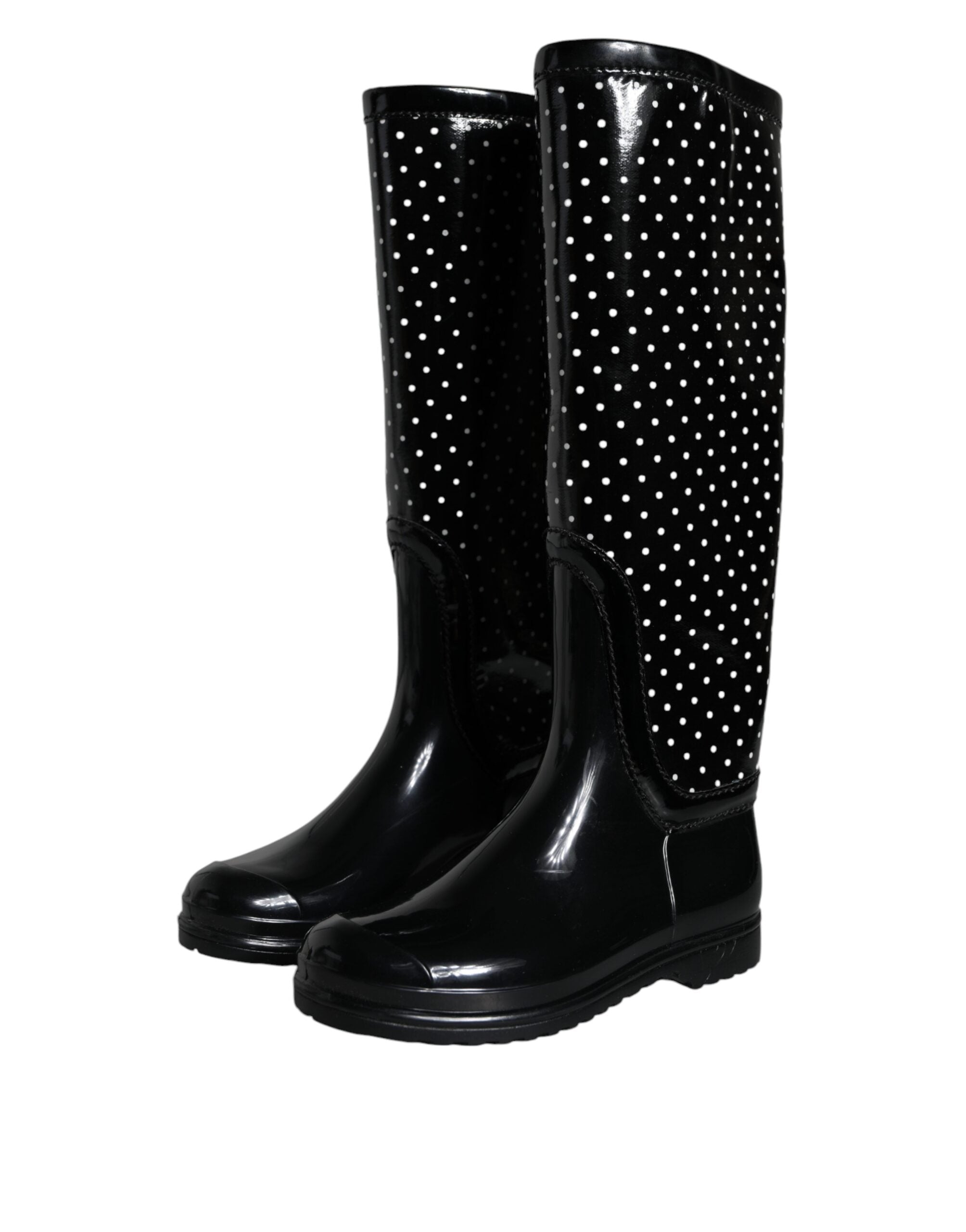 Bottes en caoutchouc noires à pois Dolce & Gabbana, bottes hautes jusqu'au genou avec motif à pois noirs et blancs.
