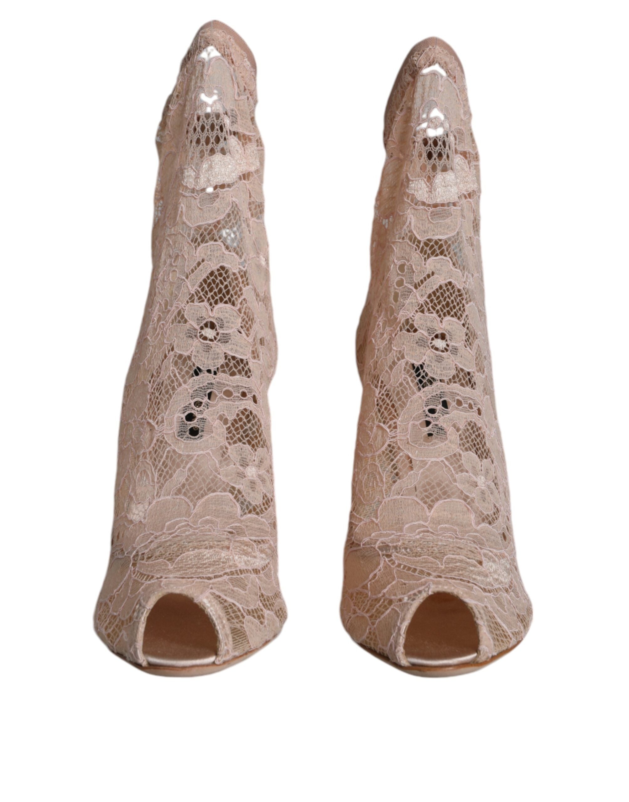 Bottes Dolce & Gabbana Taormina en dentelle beige, extensibles, avec semelle en cuir et détails élégants pour un style sophistiqué.