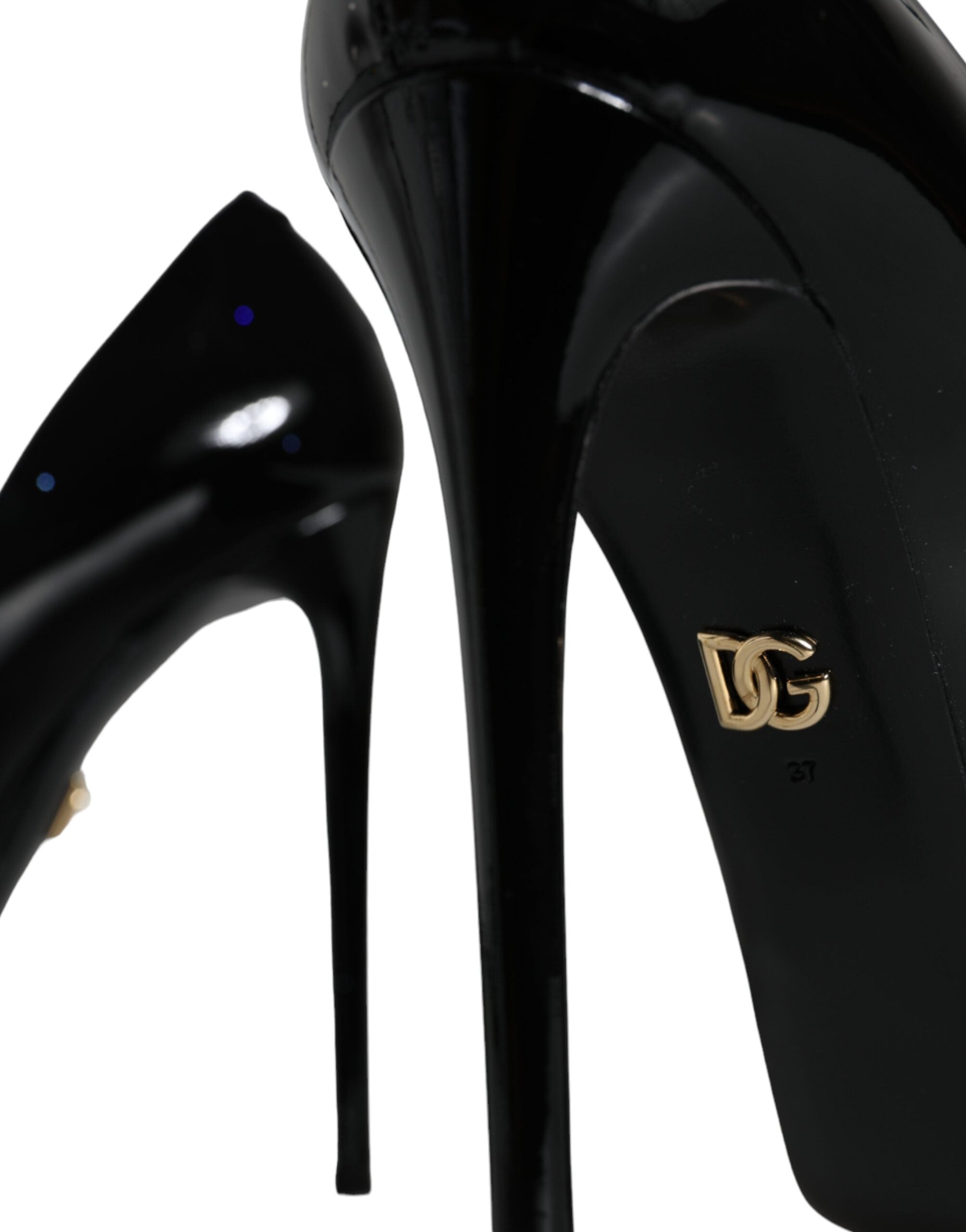 Escarpins plateformes en cuir noir de Dolce & Gabbana avec talons hauts et design élégant, visibles sur l'image.