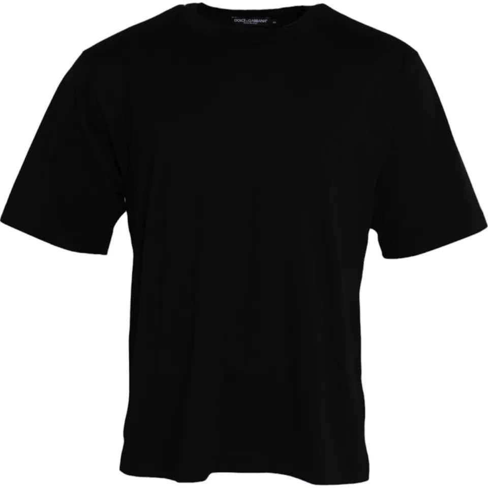 T-shirt noir en coton Dolce & Gabbana avec logo embossé, col rond et style décontracté visible sur l'image.