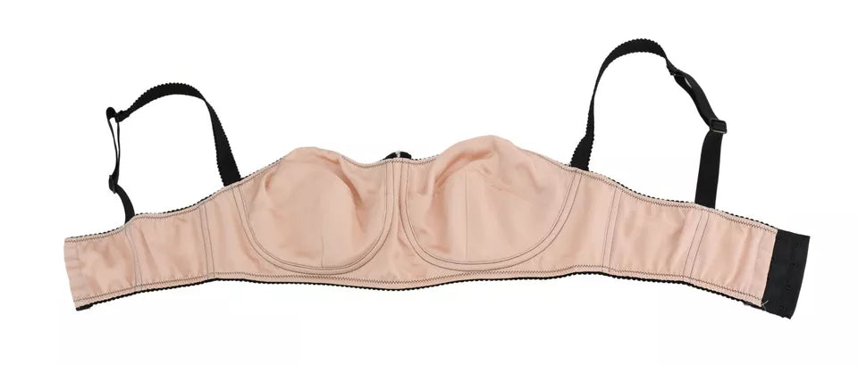 Soutien-gorge balconnet noir avec bretelles roses de la marque Dolce & Gabbana, détails élégants et finition raffinée.