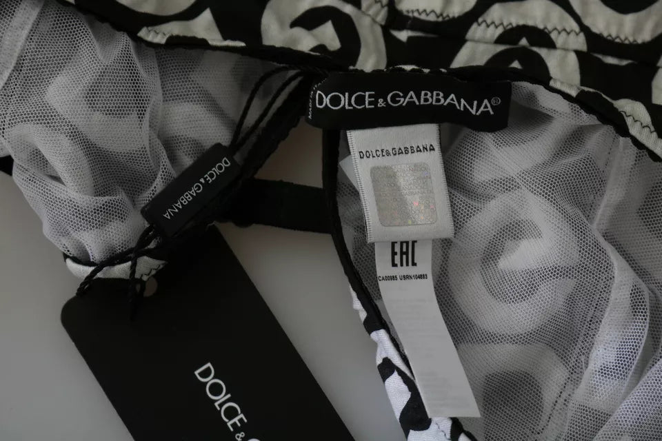 Maillot de bain sans manches Dolce & Gabbana DG Mania imprimé noir, style élégant et tendance pour la plage.