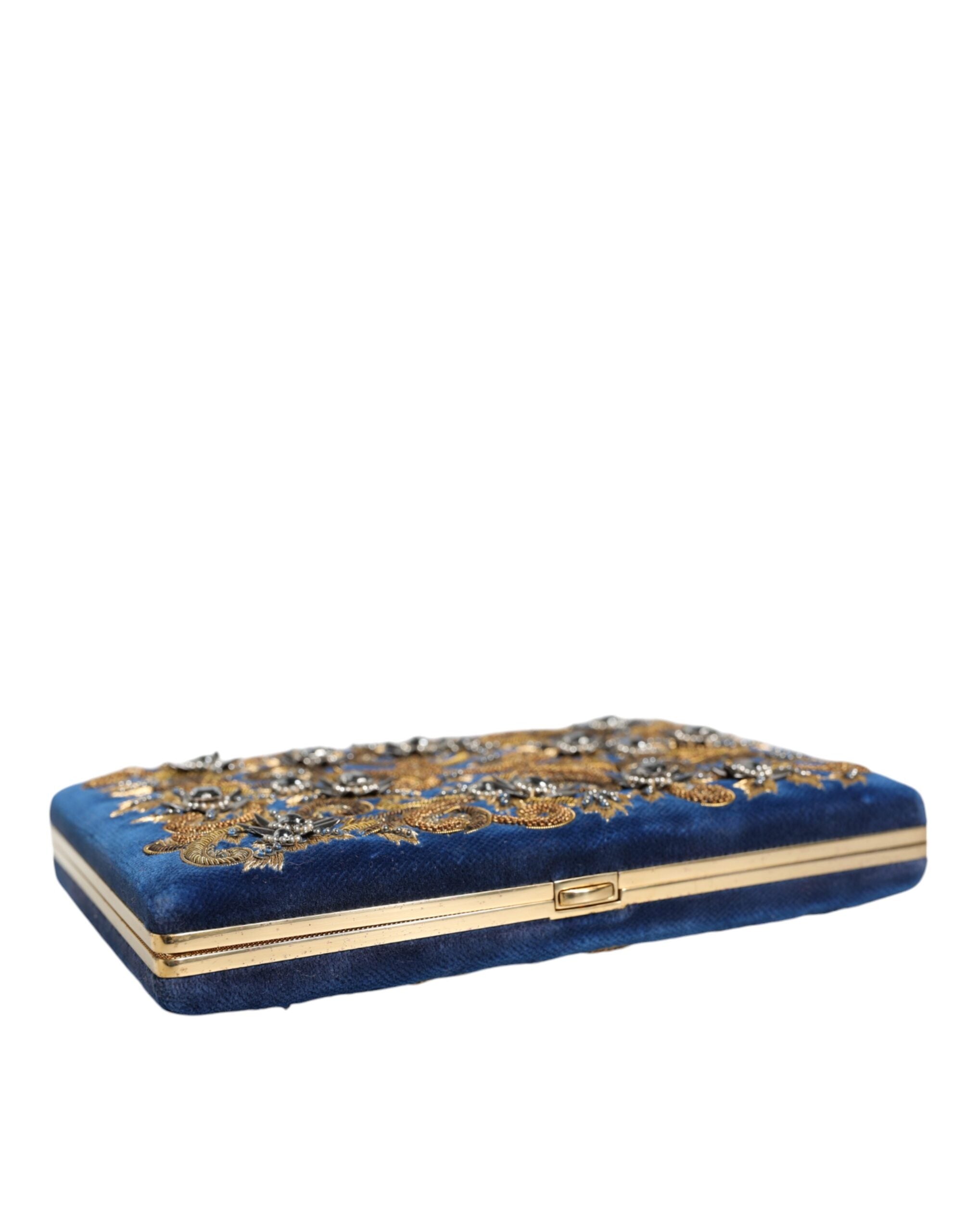 Sac pochette Dolce & Gabbana en velours bleu avec cadre doré, parfait pour soirée et événements élégants.