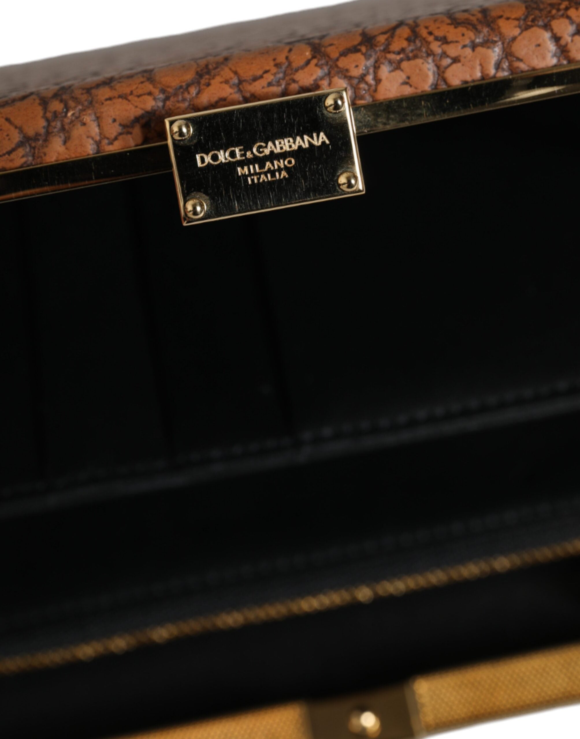 Sac clutch en cuir marron Dolce & Gabbana avec cadre doré, style mini crossbody, élégant et sophistiqué.
