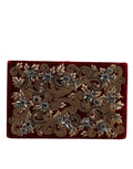 Sac pochette Dolce & Gabbana en velours rouge avec cadre en or, idéal pour soirée et événements élégants.