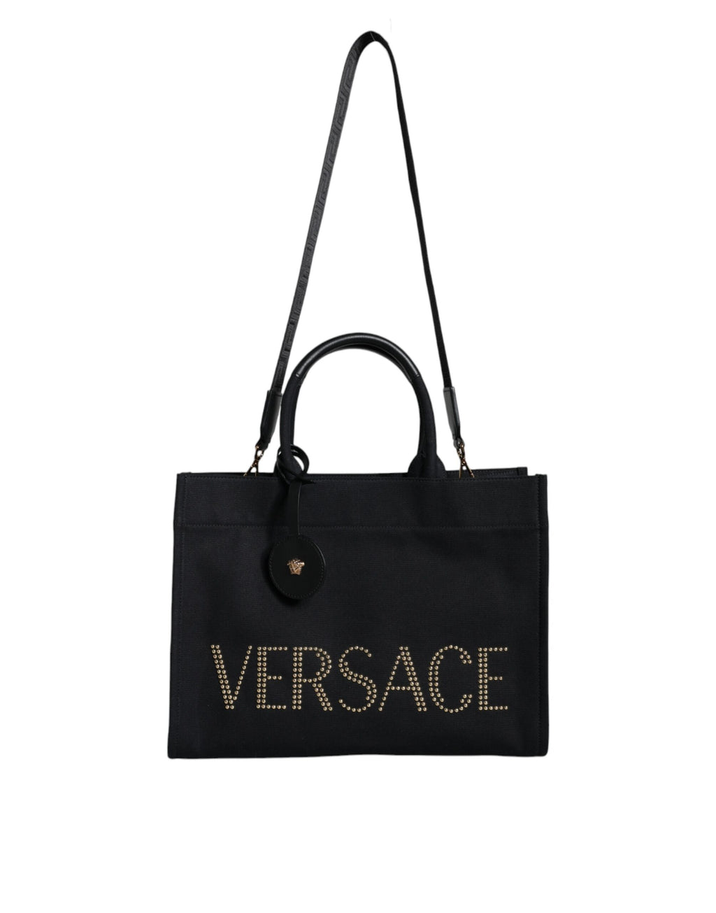 Sac à main tote à logo Versace en toile noire et cuir avec poignée, idéal pour transporter des objets avec style.