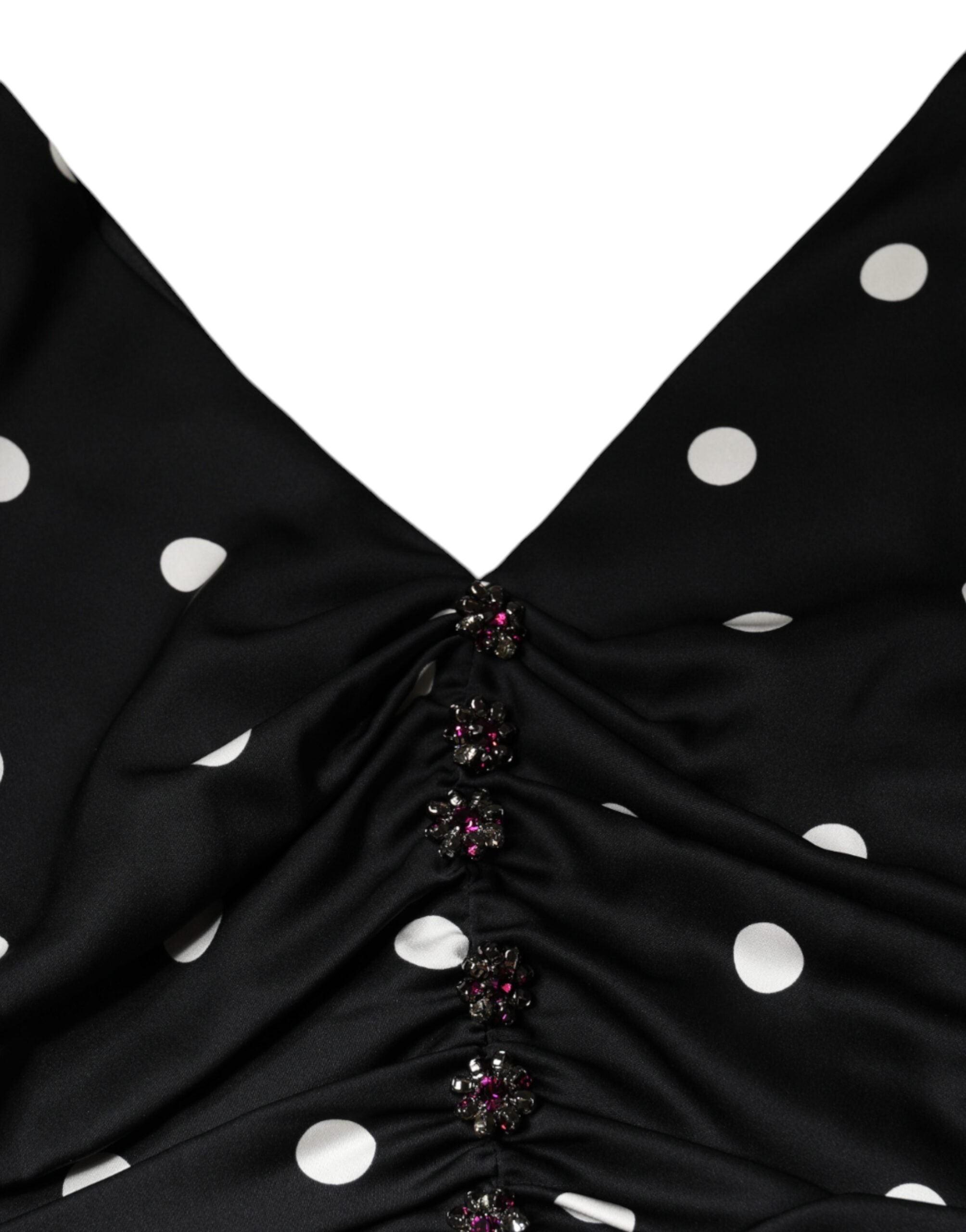 Robe midi en soie noire à pois Dolce & Gabbana avec décolleté en V et franges, style élégant et sophistiqué.