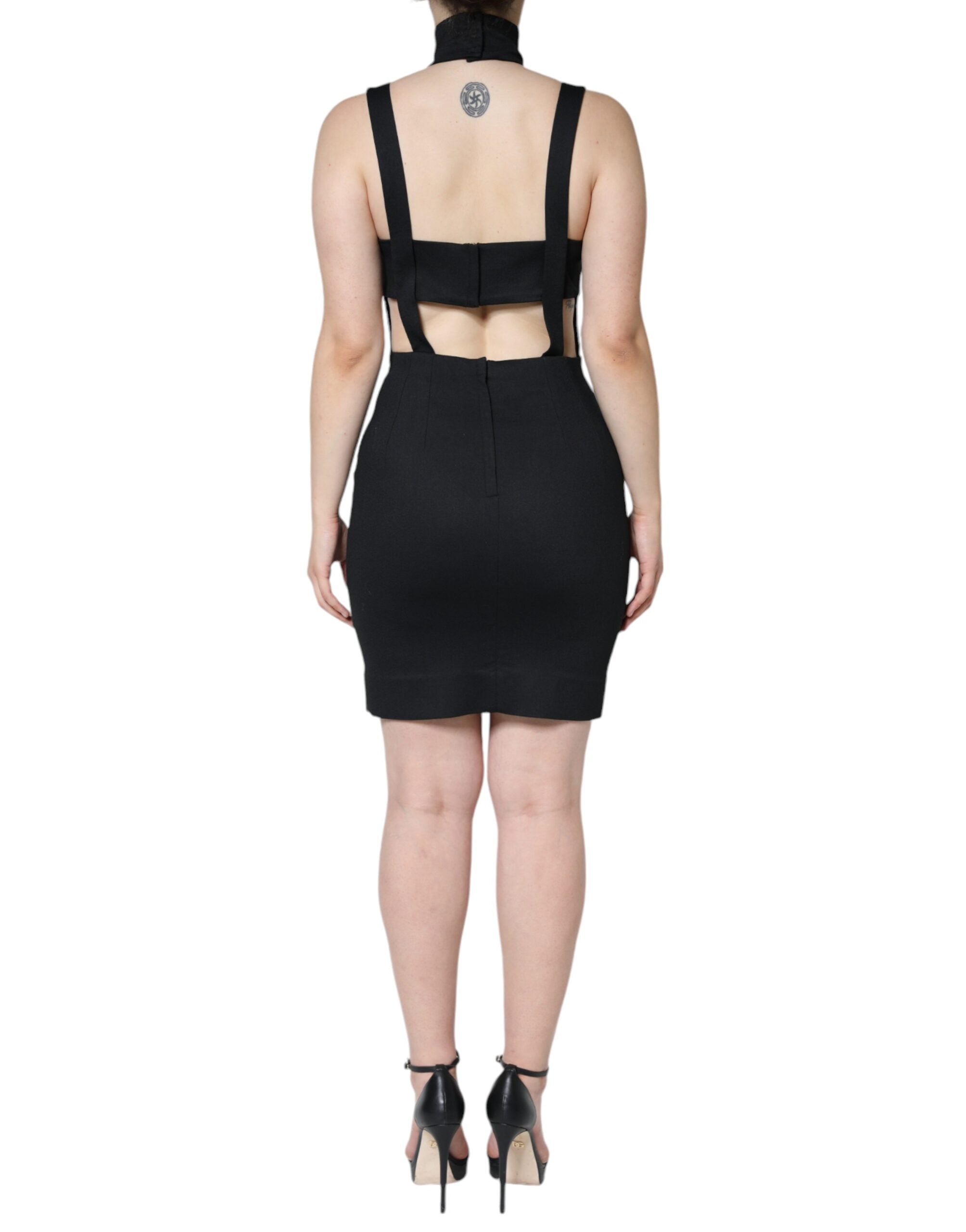 Robe courte noire sans manches de corps Dolce & Gabbana avec découpes élégantes, ajustée et sophistiquée.