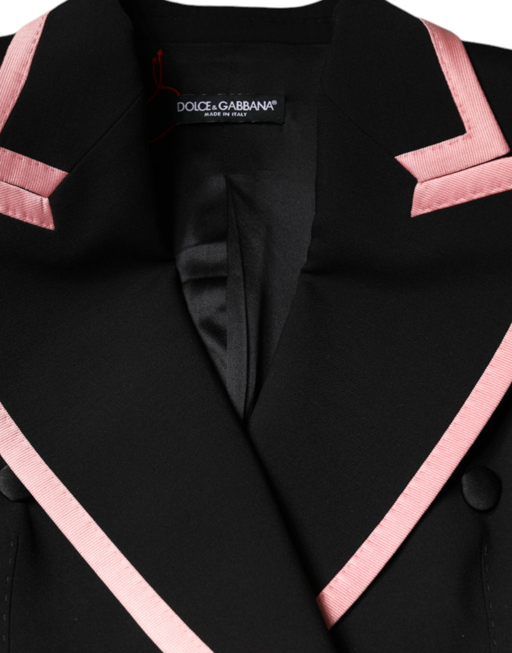 Jumpsuit sans manches en laine mélangée noire de Dolce & Gabbana, élégance moderne et style sophistiqué.