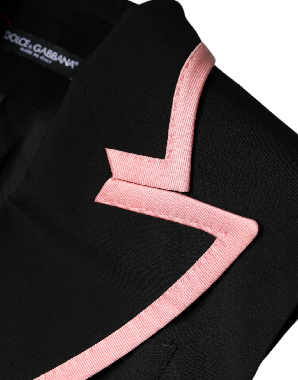 Combinaison sans manches en laine mélangée noire de Dolce & Gabbana, élégante et moderne, portée sur un fond neutre.