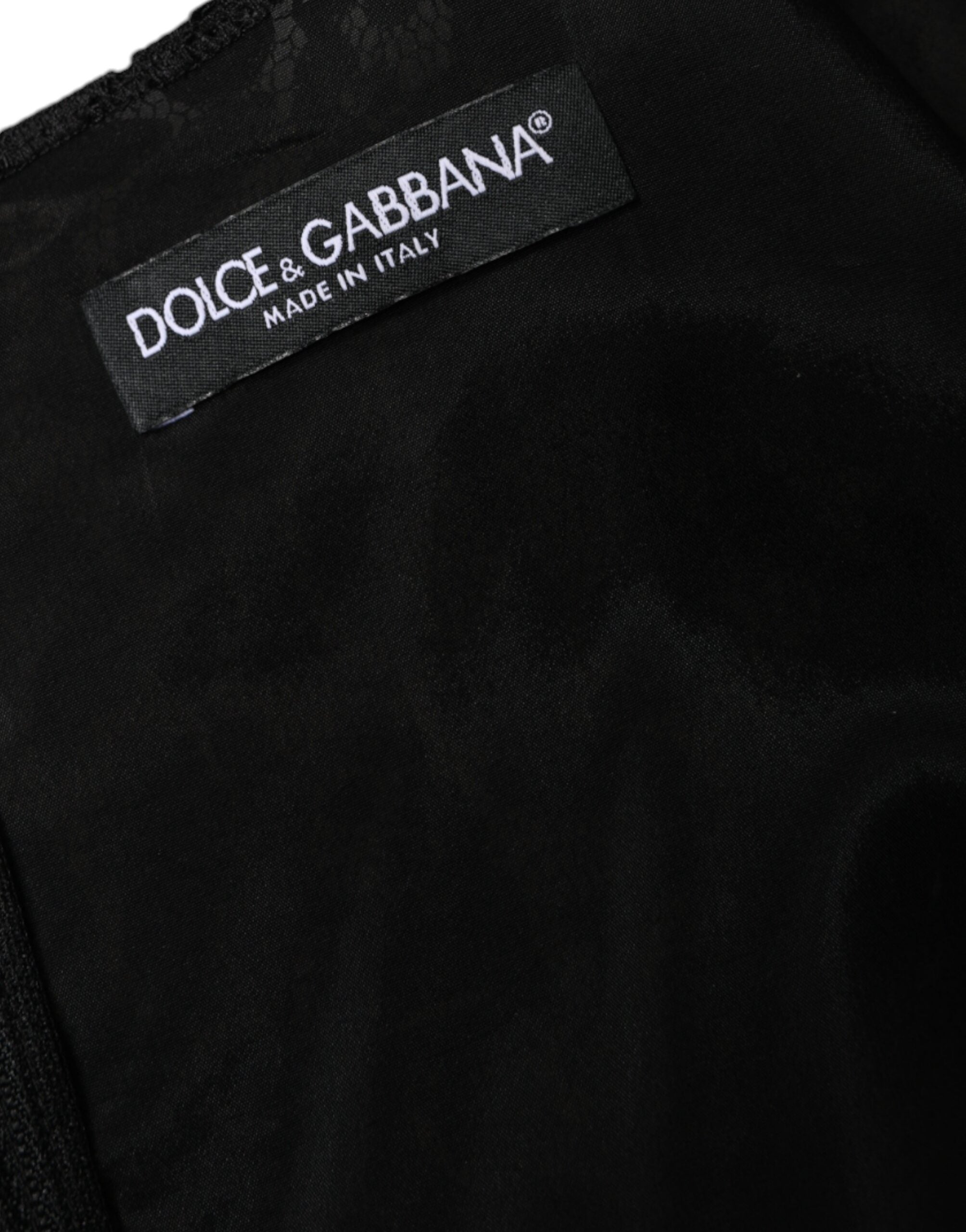 Robe courte noire en dentelle florale sans manches de Dolce & Gabbana, coupe ajustée et élégante.
