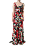 Robe longue sans manches Dolce & Gabbana en soie noire avec motif floral, élégante et fluide, idéale pour des occasions sophistiquées.