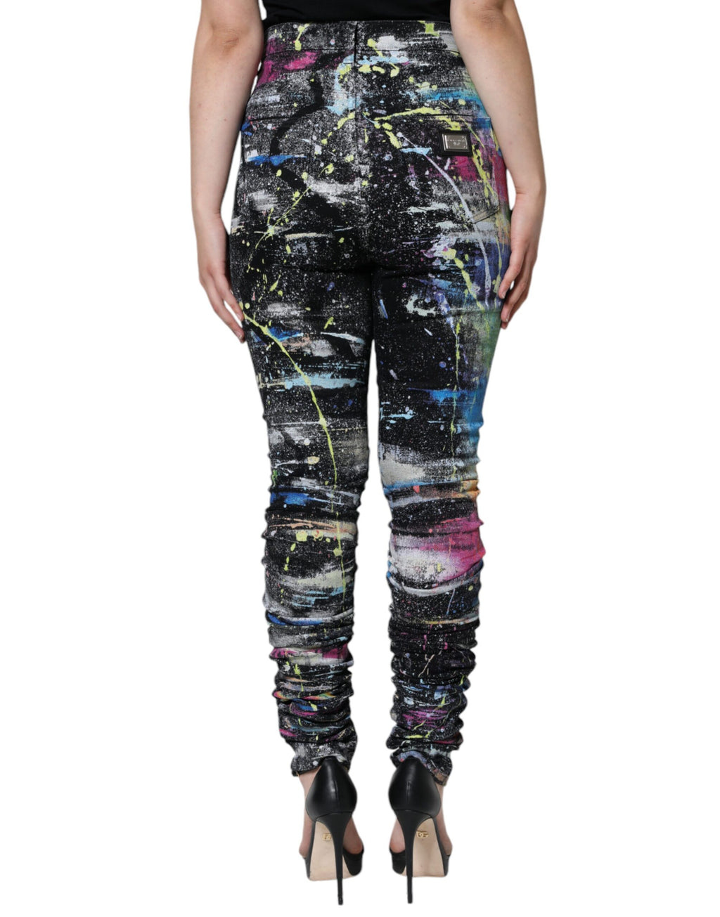 Jeans skinny en denim coton multicolore avec éclaboussures de peinture, Dolce & Gabbana, style moderne et artistique.