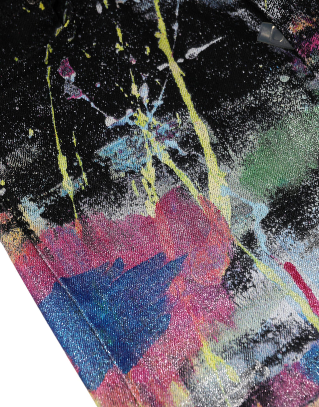 Jeans skinny en denim coton multicolore à taches de peinture de Dolce & Gabbana, style artistique et tendance.
