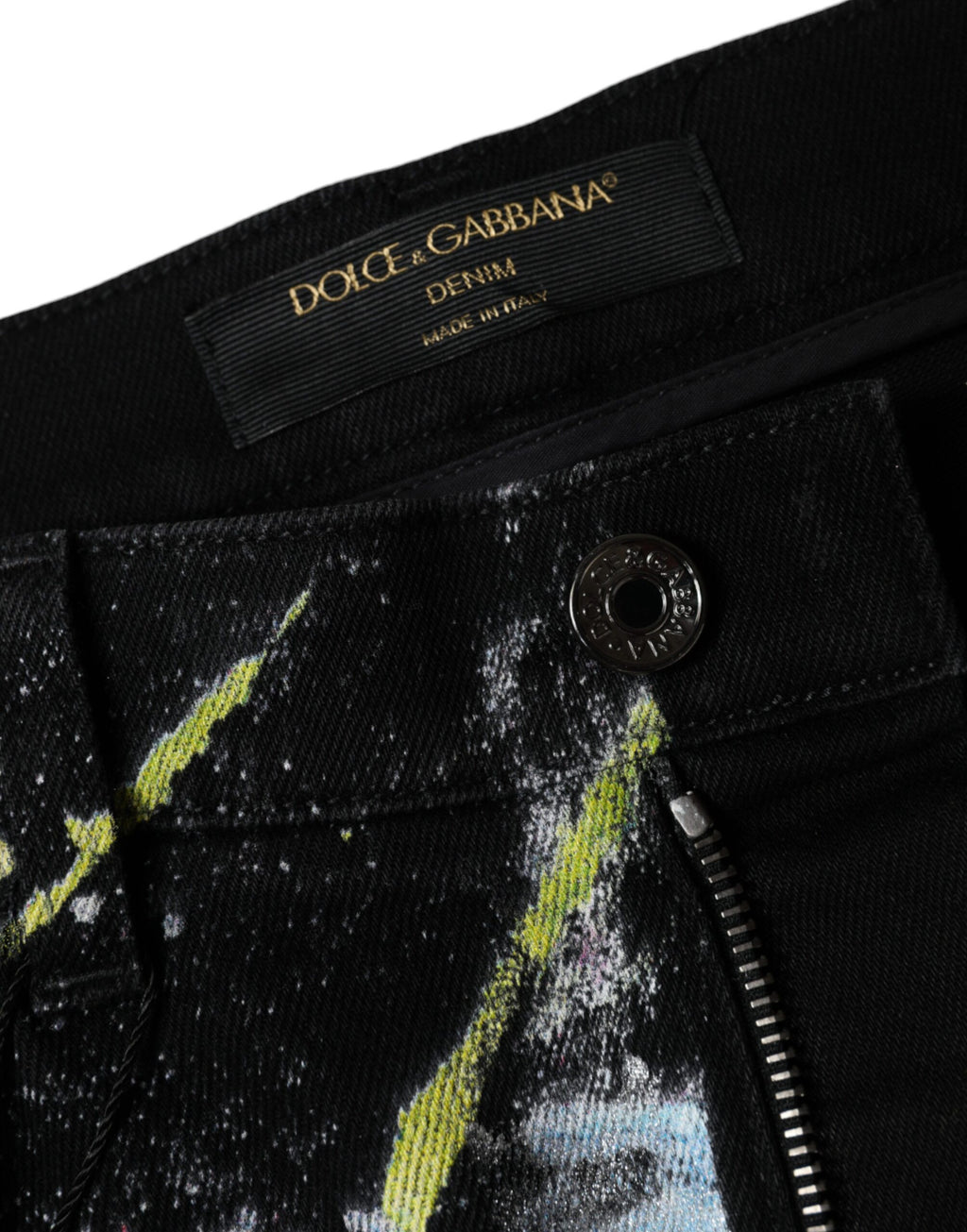 Jeans skinny en denim coton multicolore avec taches de peinture Dolce & Gabbana, style artistique et moderne.