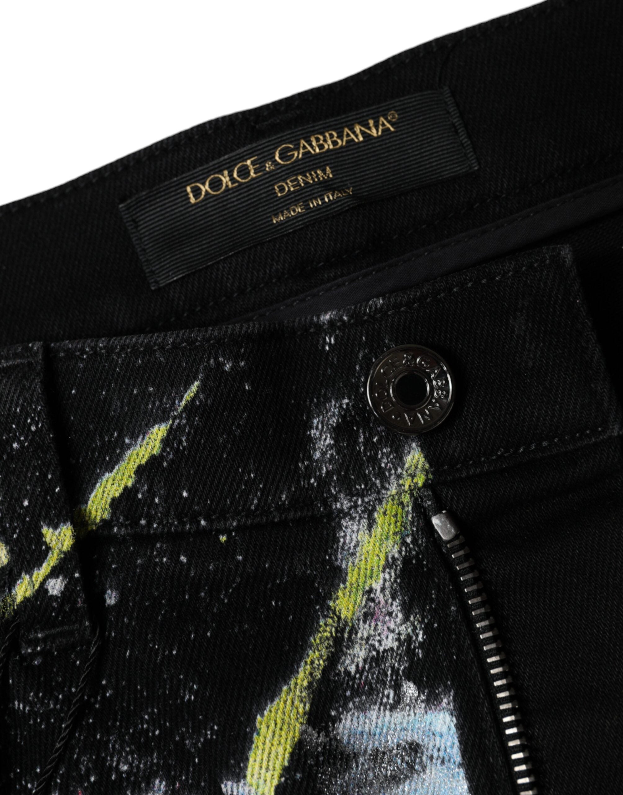 Jeans skinny en denim coton multicolore avec taches de peinture Dolce & Gabbana, style artistique et moderne.