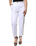 Jeans en denim blanc Dolce & Gabbana, taille mi-haute, coupe taper, en coton, affichant une finition classique et moderne.