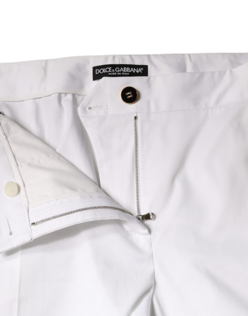 Jeans en coton blanc Dolce & Gabbana, coupe tapered à taille moyenne, denim tendance visible sur cette image.