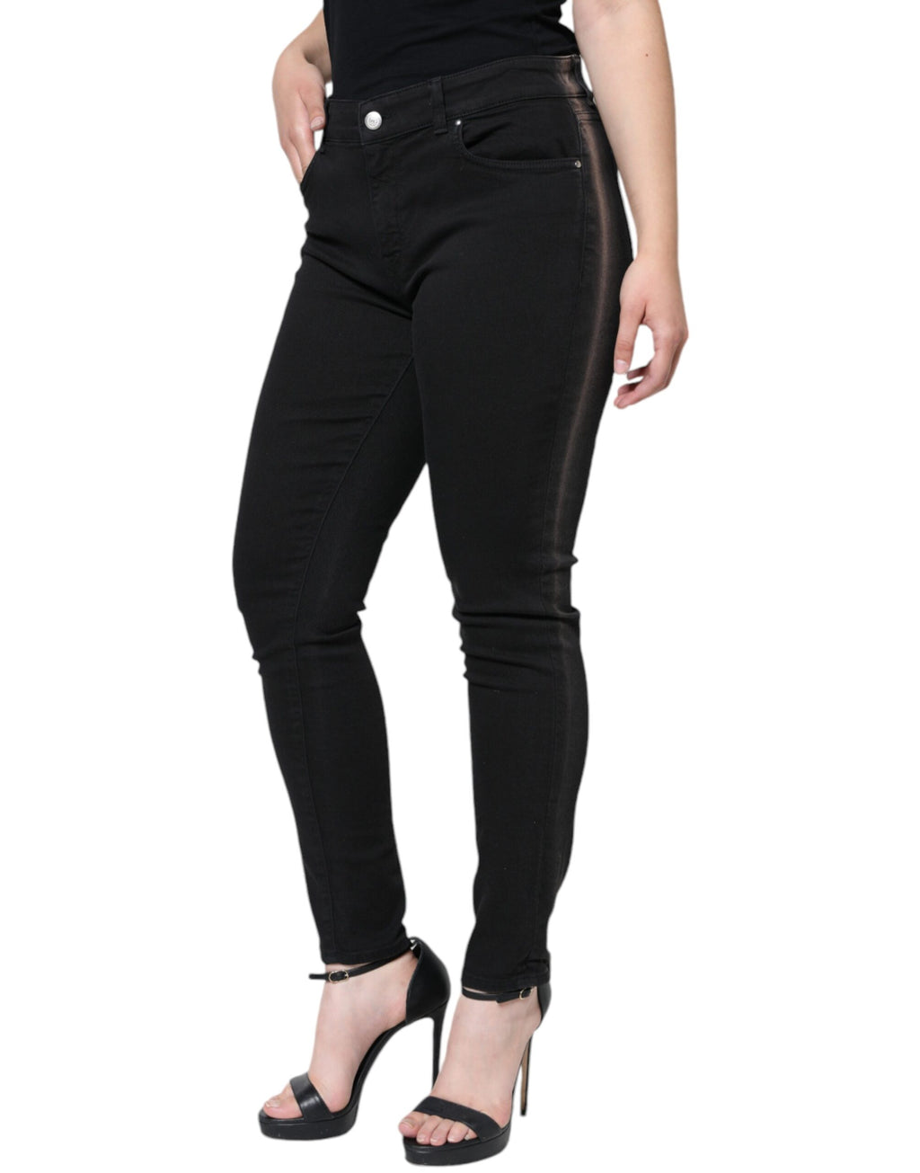 Jeans skinny en denim stretch noir Dolce & Gabbana en coton, vue de face, avec détails classiques et coupe ajustée.
