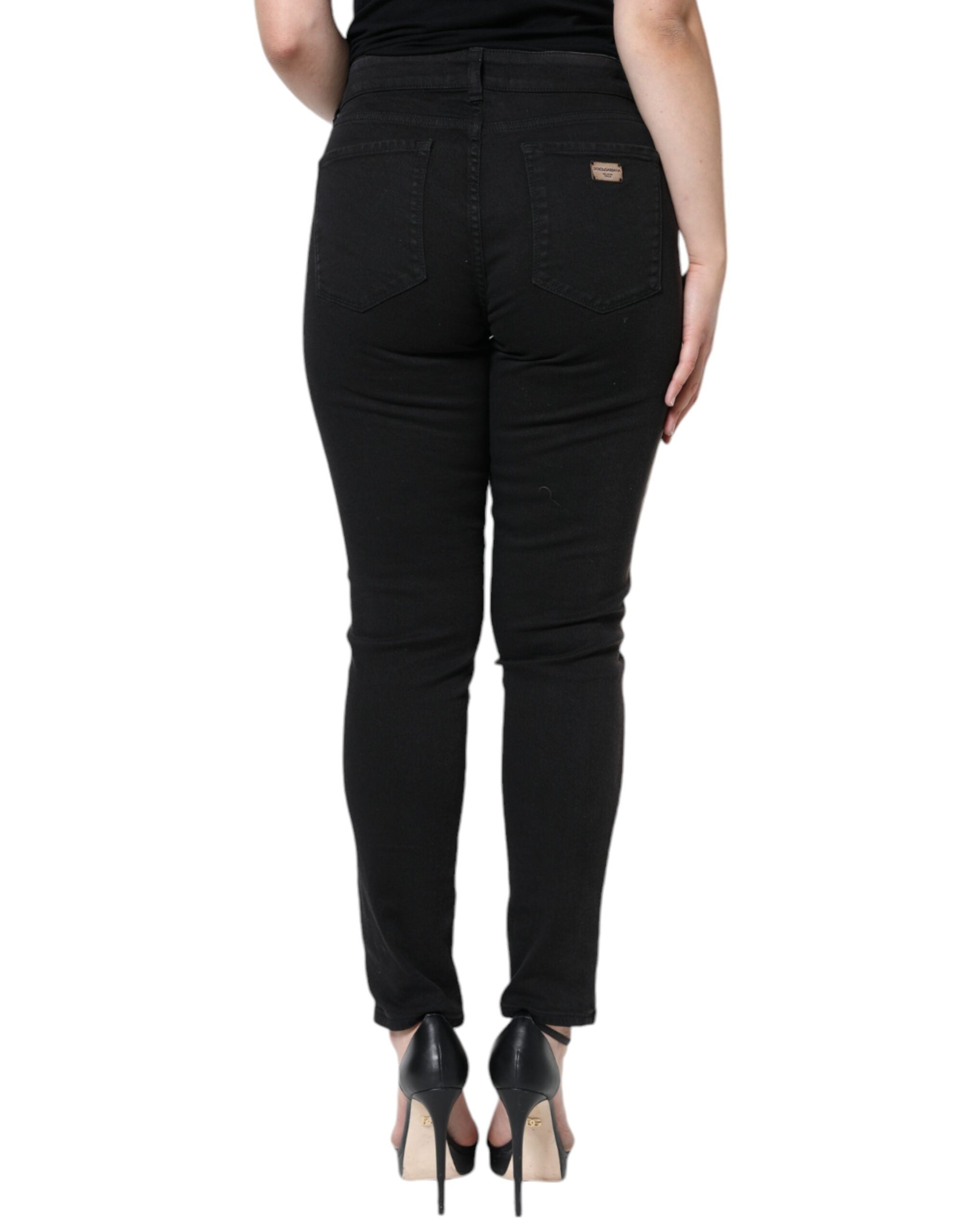 Jeans skinny en denim noir en coton stretch de Dolce & Gabbana, ajustés et modernes, visibles avec fermeture éclair et poches.