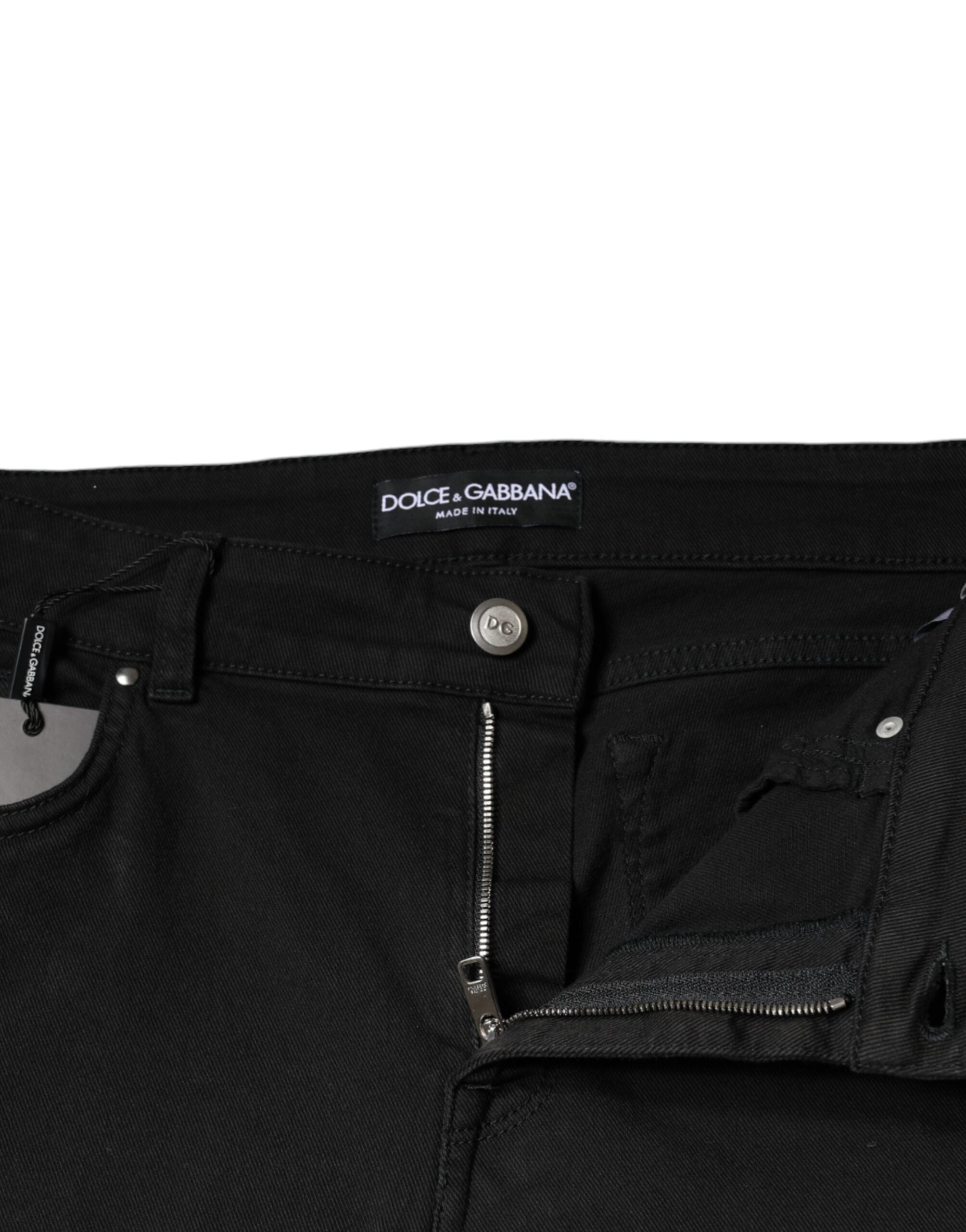 Jeans skinny en denim noir en coton stretch de Dolce & Gabbana, ajustés et modernes, visibles en gros plan.