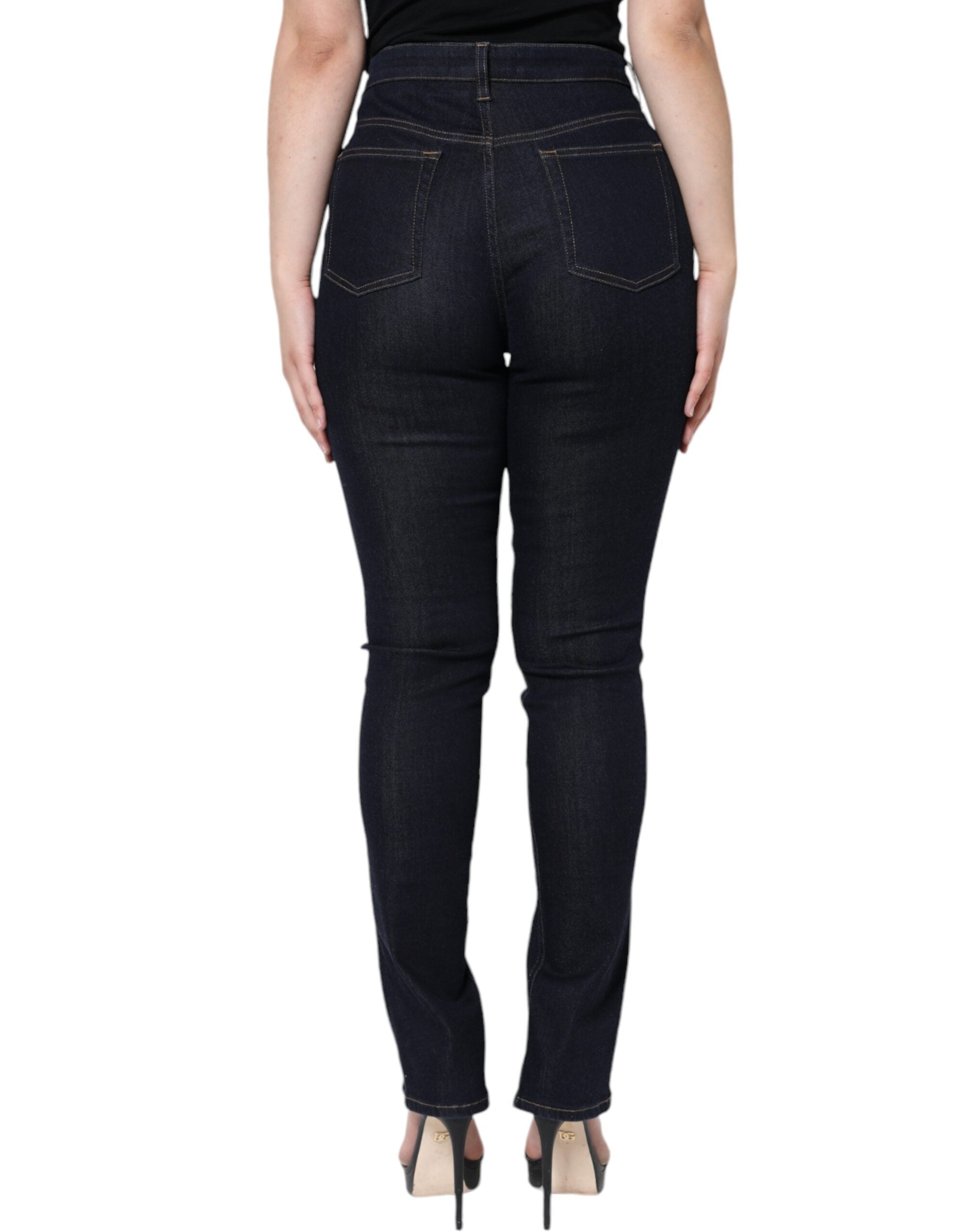 Jean skinny en coton mélangé noir de Dolce & Gabbana, coupe ajustée, détails modernes, porté sur un mannequin.