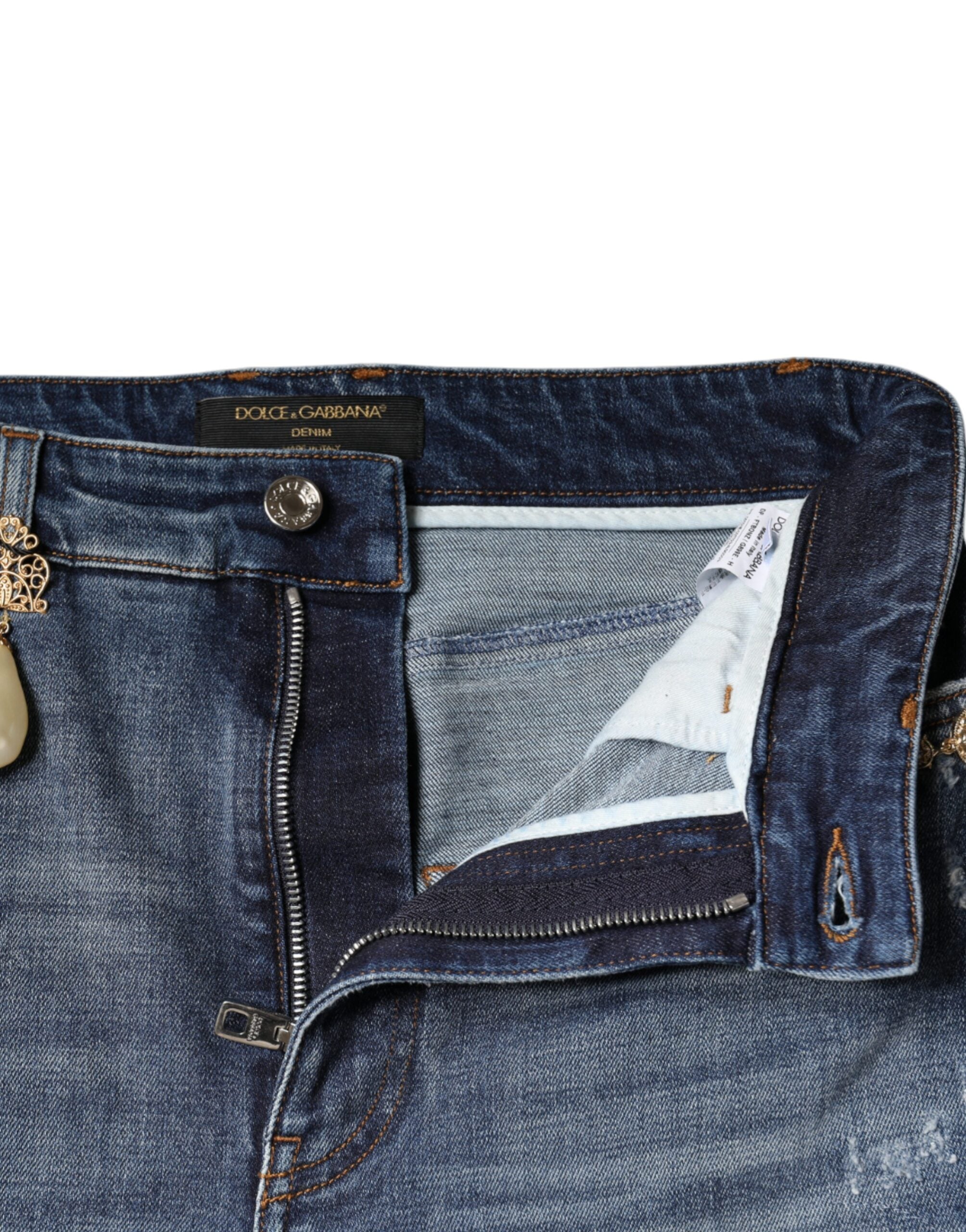 Jeans skinny en denim tattered bleu foncé de Dolce & Gabbana, en coton, avec un style décontracté et usé.
