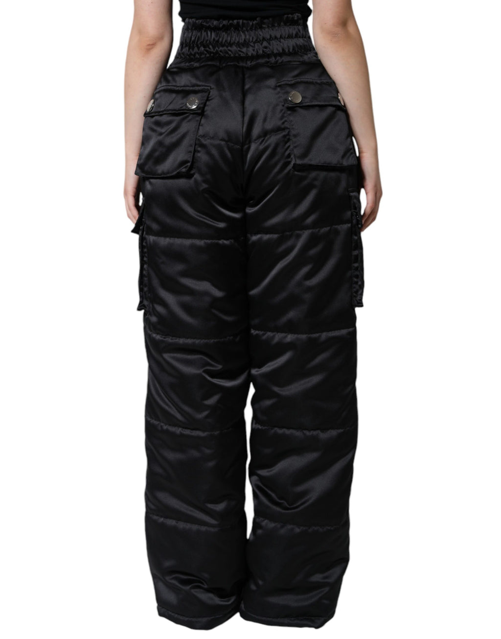 Pantalons pour femmes Dolce & Gabbana noirs à taille haute, coupe boot cut, finition matelassée, élégants et tendance.