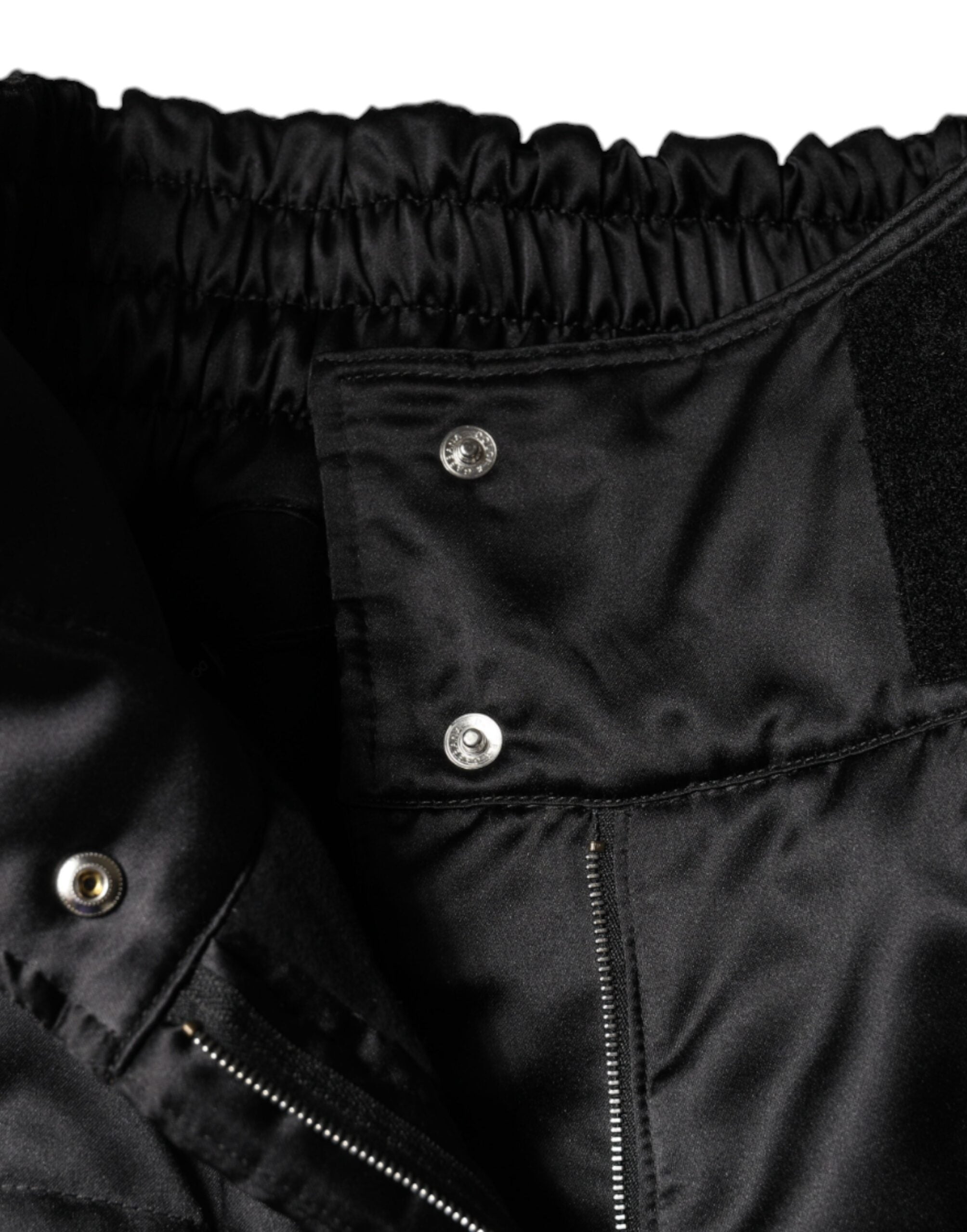 Pantalon noir Dolce & Gabbana pour femmes, coupe boot cut, taille haute, en tissu matelassé, élégant et tendance.
