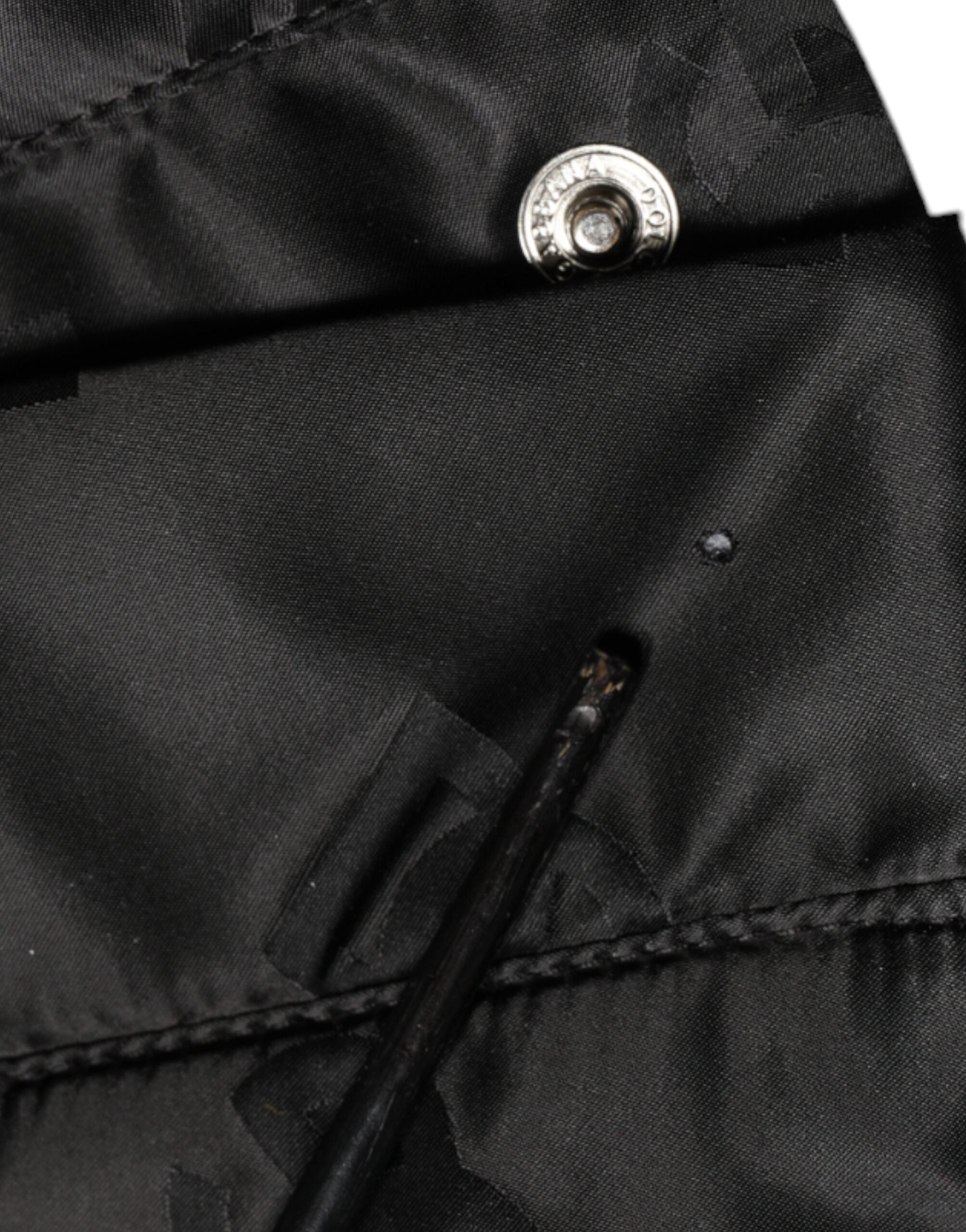 Pantalons femme Dolce & Gabbana noir à taille haute, en tissu matelassé, coupe large et élégante.
