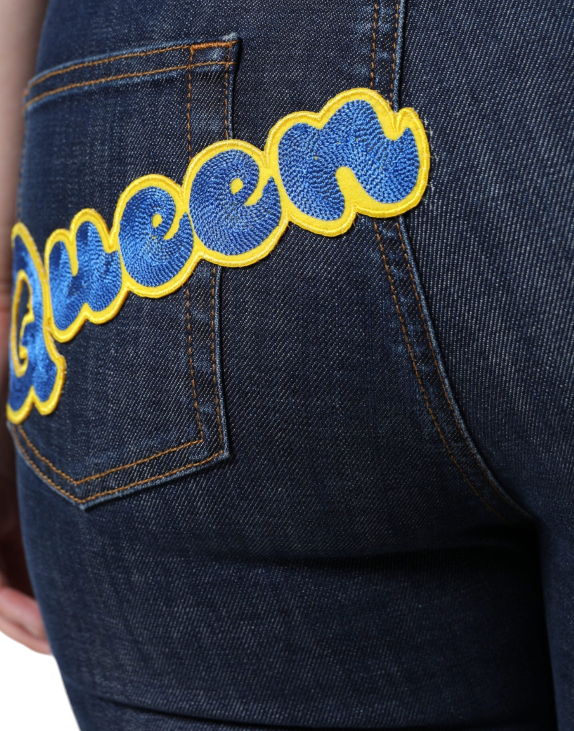 Jeans skinny en coton bleu foncé Dolce & Gabbana Queen, coupe ajustée et détails classiques visibles sur la photo.