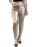 Pantalon skinny taille haute en métal doré Dolce & Gabbana, coupe ajustée et élégante, visible en détail dans l'image.