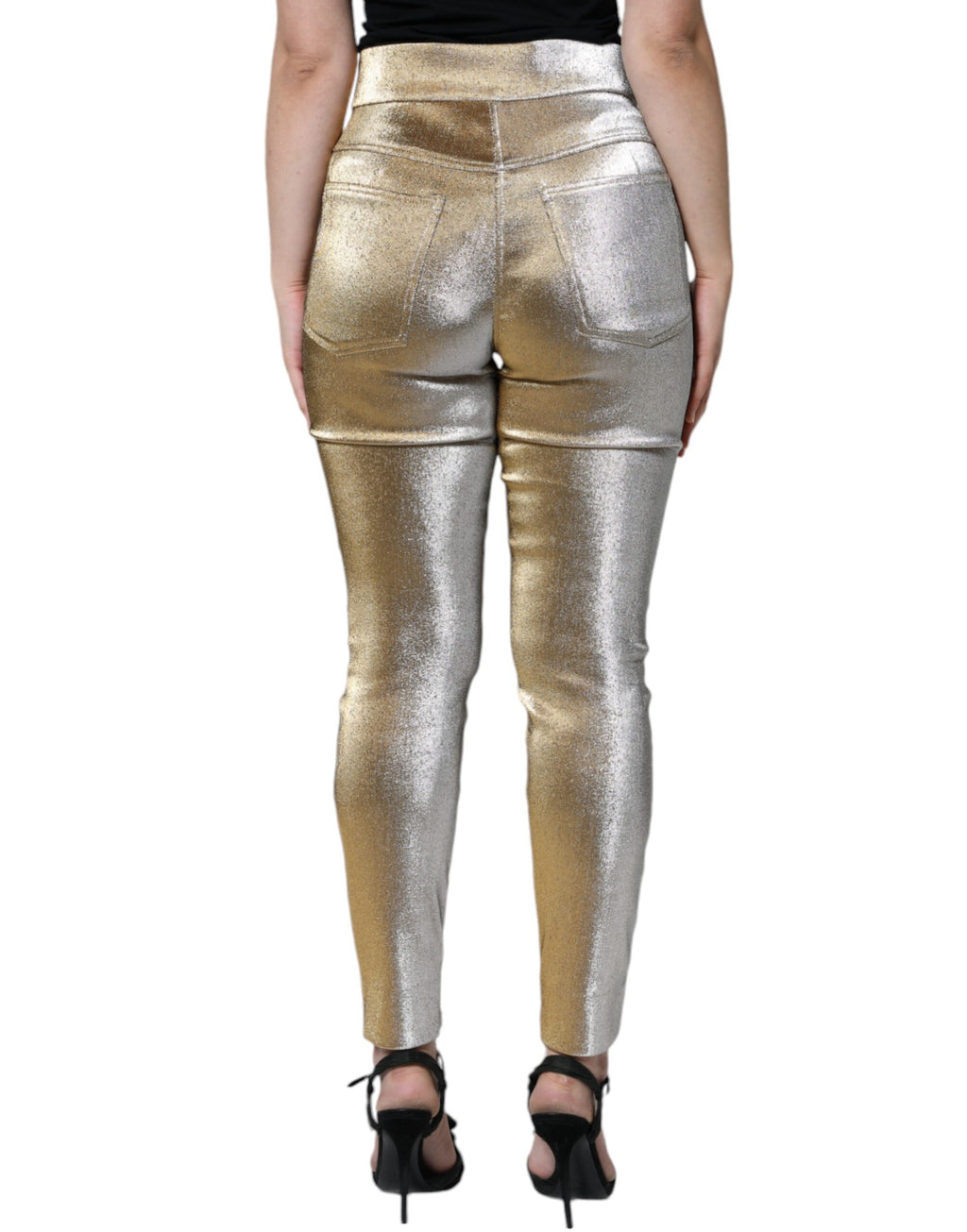 Pantalons skinny dorés métalliques à taille haute de Dolce & Gabbana, style chic et tendance, en tissu brillant.